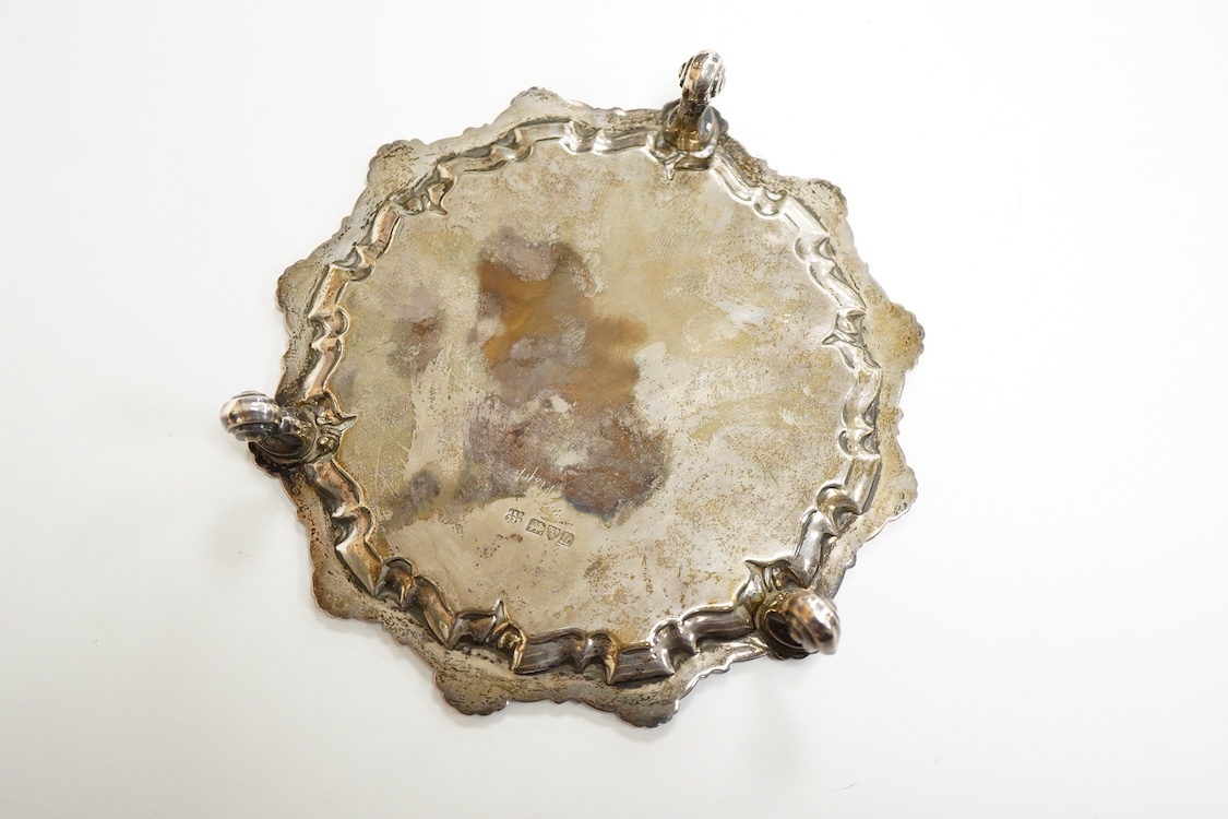 A George V silver waiter, by Barker Brothers, Chester, 1911, with shell and scroll border, on three scroll feet, 15.7cm, 4.5oz.